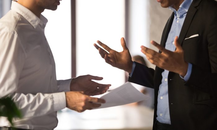 Businessmen-Talking-About-Managing-a-PR-Crisis Businessmen-Talking-About-Managing-a-PR-Crisis